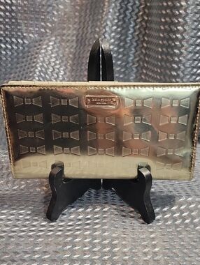 kate spade metallic gold embossed bow clutch wallet